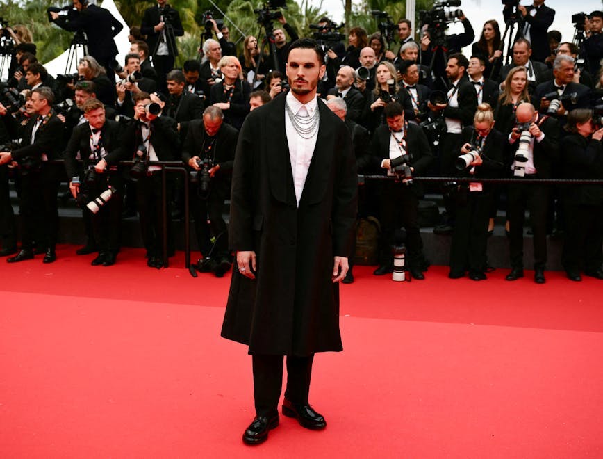 film horizontal celebrity full length arts culture and entertainment film industry celebrities international cannes film festival film festival cannes adult male man person clothing coat electronics camera photoshoot