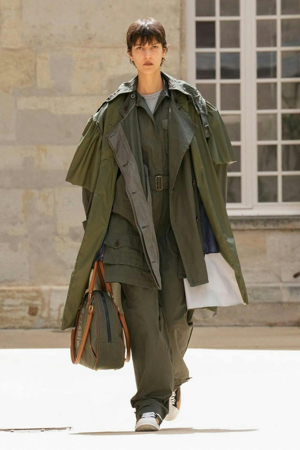 clothing coat fashion adult male man person bag handbag overcoat