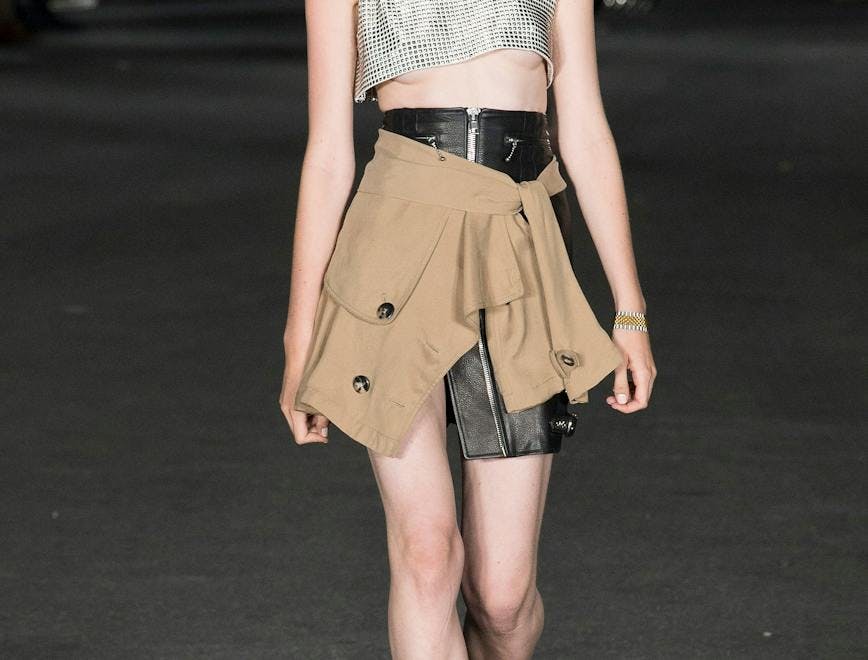 skirt clothing apparel person human runway shorts