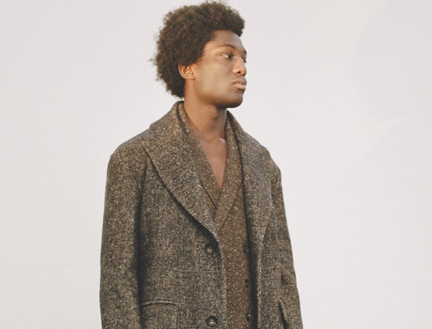 clothing apparel person human overcoat coat hair