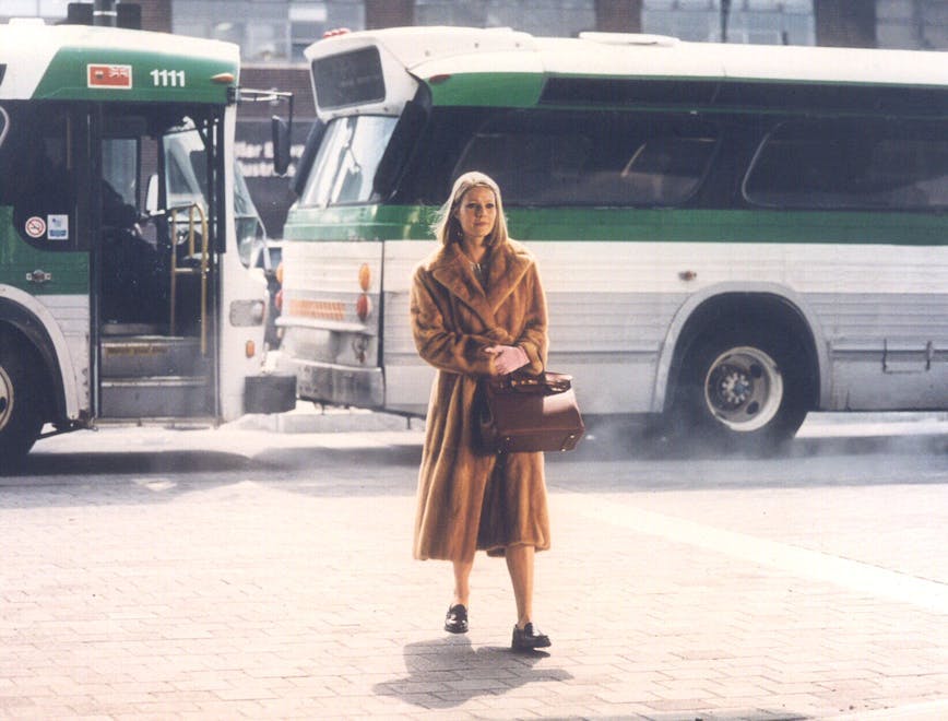 clothing bus vehicle transportation person minibus van coat overcoat wheel