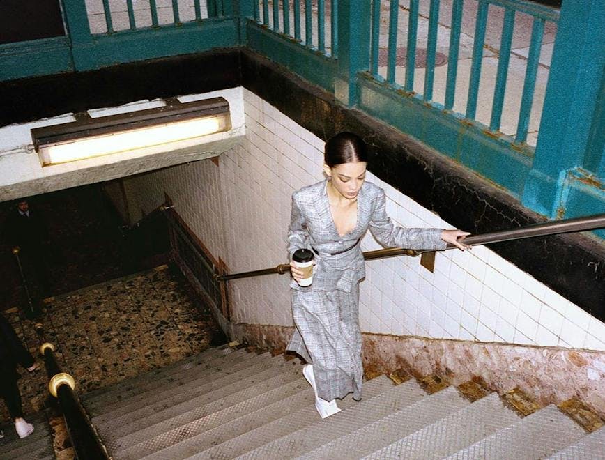 handrail banister clothing apparel person human robe fashion