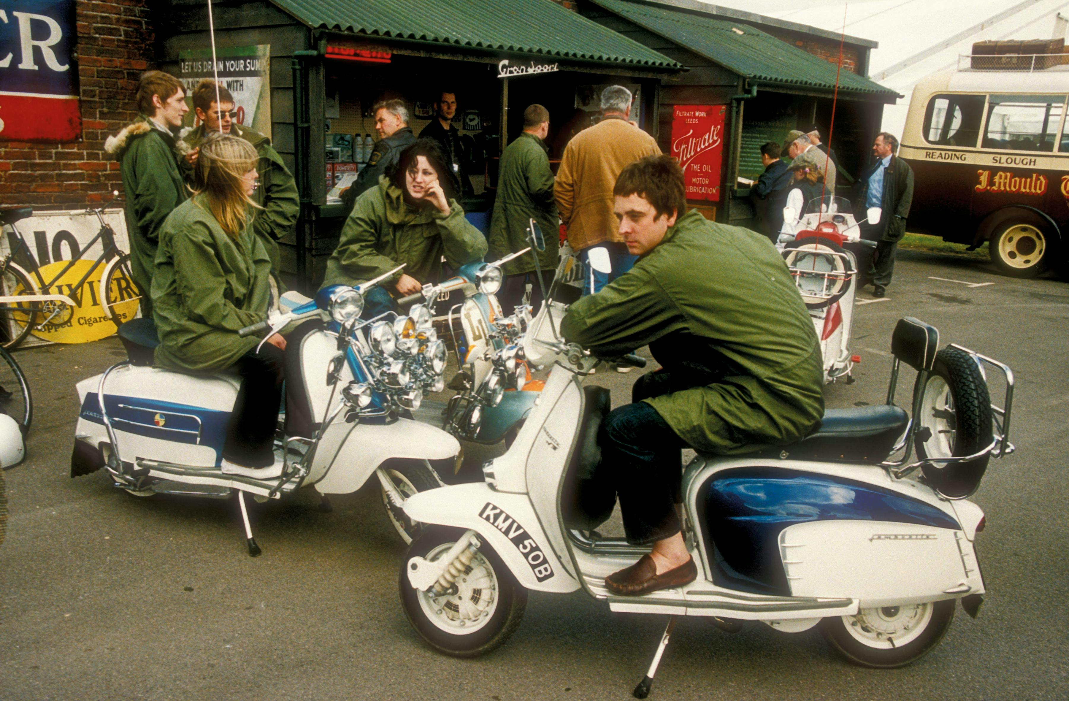uk united kingdom great britain england 2000s adults white male female men women girls mods clothing parkas woman guys clothes 60s caucasian sixties scooters scooterists goodwood revival person wheel machine motorcycle vehicle transportation motor scooter bicycle bus moped