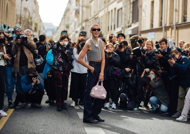 paris paparazzi person human shoe clothing footwear apparel photographer sunglasses accessories