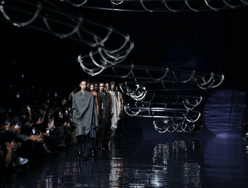 milan fashion stage coat person man adult male people lighting crowd