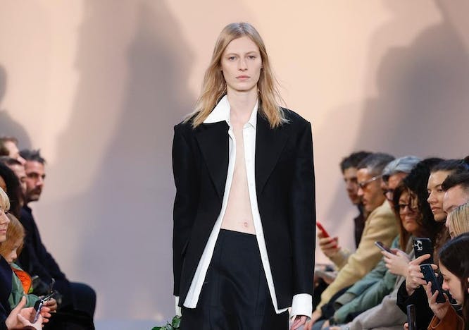 coat clothing suit formal wear blazer jacket mobile phone fashion handbag glasses