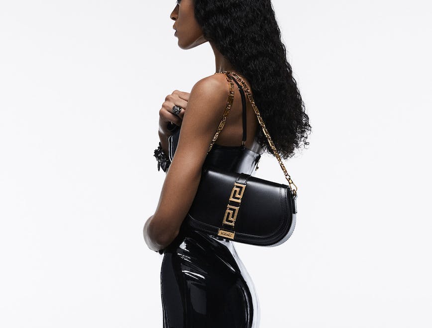 handbag bag accessories purse person woman adult female face black hair