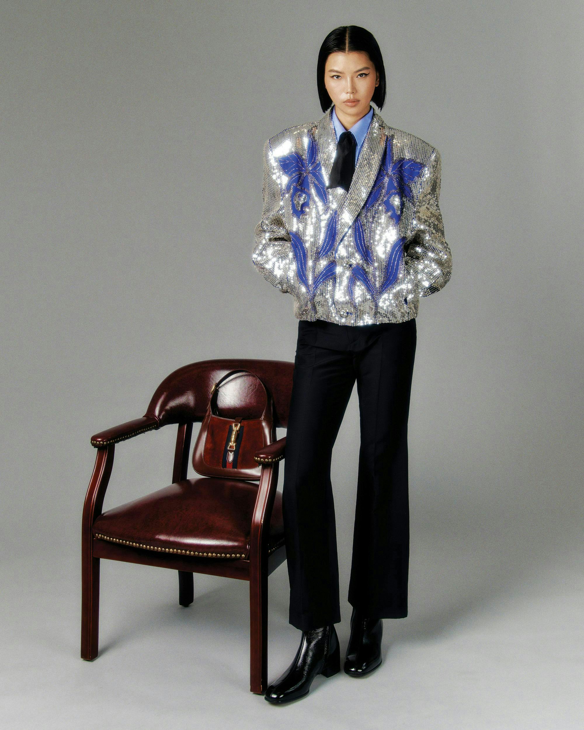 blazer coat jacket formal wear suit blouse long sleeve chair person woman