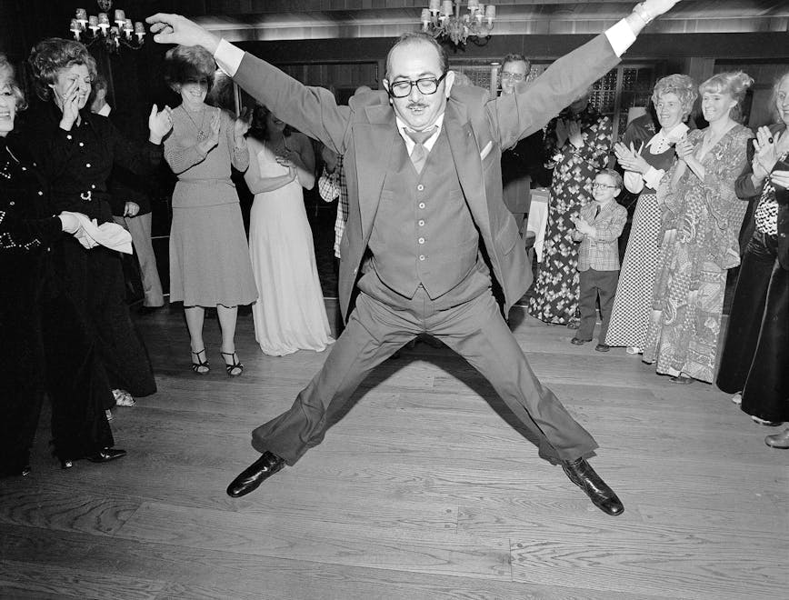 Man in a 3 Piece Suit Dancing Within the Circle at a Wedding, Rockille Centre, NY, 1976. © Meryl Meisler / Courtesy Polka Galerie.