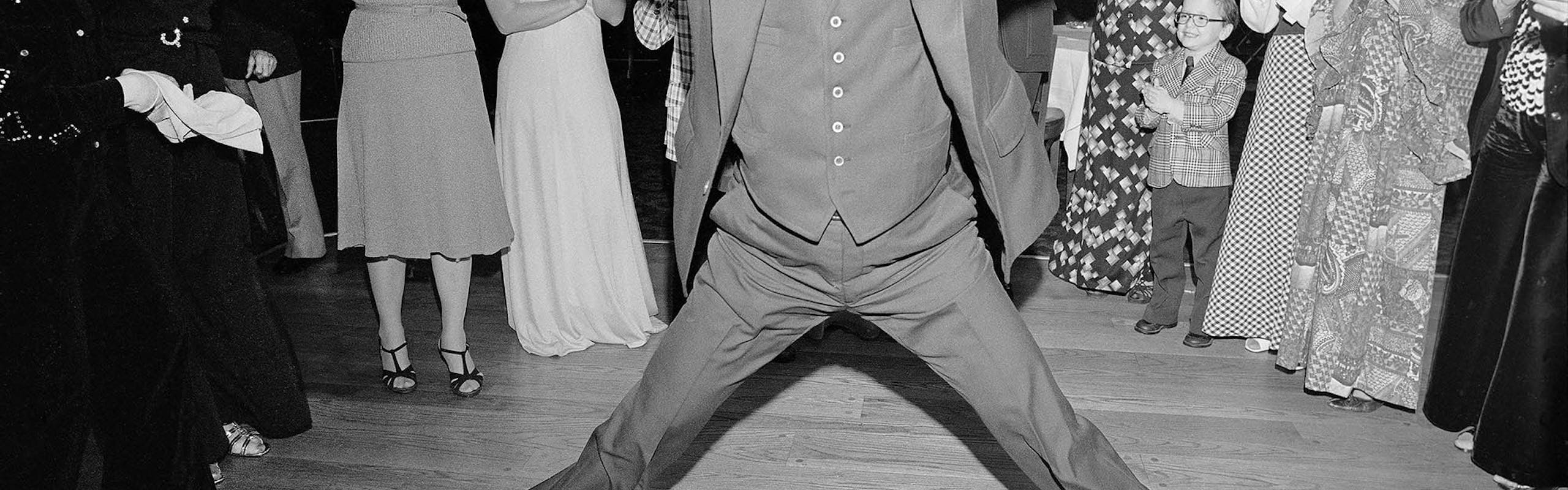 Man in a 3 Piece Suit Dancing Within the Circle at a Wedding, Rockille Centre, NY, 1976. © Meryl Meisler / Courtesy Polka Galerie.